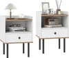 Two identical white nightstands with wood-effect shelves and drawers, displayed side-by-side against a white background. Podgląd zdjęcia produktu