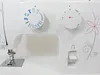 Close-up view of the control panel and sewing needle of a white sewing machine. Náhled obrázku produktu