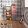 A child's room with a storage unit and toys. Produktbild-Vorschau