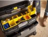 A person is sorting screws into a yellow compartment of a tool organizer. Voir les images du produit