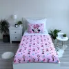 A child's bed with Minnie Mouse themed bedding. Podgląd zdjęcia produktu