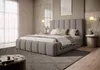 A bedroom scene with a large bed as the focal point. Produktbild-Vorschau
