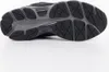 The underside of a black and gray athletic shoe, showing the sole pattern and branding. Produktbild-Vorschau