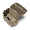 An open cosmetic bag with internal compartments, shown against a white background. Anteprima dell’immagine prodotto