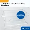 Interior view of a refrigerator with adjustable glass shelves and a crisper drawer. Produktbild-Vorschau
