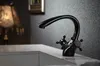 A black faucet is shown on a white countertop. Anteprima dell’immagine prodotto