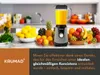 A blender filled with orange juice is surrounded by a variety of fresh fruits on a kitchen counter. Produktbild-Vorschau