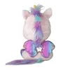 A plush unicorn toy is shown from the back, sitting down. Podgląd zdjęcia produktu