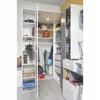 Interior view of an open closet in a youth room, showing shelves filled with various items and a desk area. Produktbild-Vorschau