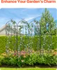 Four decorative metal garden trellises with climbing plants and flowers in a garden setting. Produktbild-Vorschau
