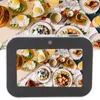 A collage of images showing a digital camera displaying a breakfast scene, with the camera itself in the foreground. Podgląd zdjęcia produktu