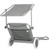 A gray beach chair with wheels and a sunshade, shown from the back. Anteprima dell’immagine prodotto