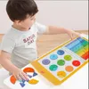 A young child is playing with a math learning toy on a table. Náhľad obrázku produktu