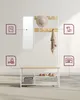 A hallway coat rack with a mirror, hat, and scarf, featuring storage shelves for shoes and a basket. Icons highlight features like the mirror, seating, and storage. Náhled obrázku produktu