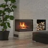A modern living room corner with a fireplace, firewood storage, and a large potted plant. Produktbild-Vorschau
