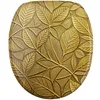 A close-up view of a toilet seat with a detailed embossed leaf pattern in a gold finish. Produktbild-Vorschau