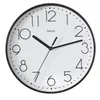 A close-up studio shot of a black and white analog wall clock. Produktbild-Vorschau
