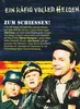 A promotional image for the TV series 'Ein Käfig voller Helden' (Hogan's Heroes), featuring three main characters in uniform against a backdrop resembling a German flag and barbed wire. Náhľad obrázku produktu