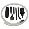 A set of vacuum cleaner attachments and a hose are arranged in a circular pattern on a white background. Produktbild-Vorschau