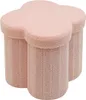 A pink clover-shaped ottoman with three cylindrical legs.