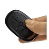 A hand holding a black remote control with buttons. Podgląd zdjęcia produktu