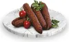 Sausages, cherry tomatoes, and parsley on a marble plate. Náhled obrázku produktu