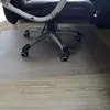 The base of an office chair is shown on a floor mat. Náhled obrázku produktu