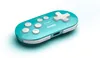 A turquoise 8BitDo Zero 2 Bluetooth gamepad is shown on a white and light blue gradient background. Náhľad obrázku produktu