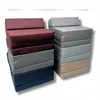 Two stacks of folded mattresses in different colors. Produktbild-Vorschau