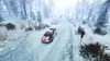 A rally car driving on a snowy forest road. Produktbild-Vorschau
