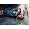 A person is using a jigsaw to cut metal. Voir les images du produit