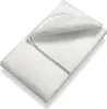 A white mattress protector is folded and lying on a white surface. Náhled obrázku produktu