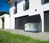 A modern white house with a dark gray storage box in front of it. Náhľad obrázku produktu