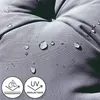 Close-up of a gray cushion with water droplets on it, showing its water-repellent and UV-resistant features. Produktbild-Vorschau