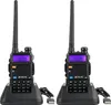 Two black walkie-talkies are shown in their charging docks against a white background. Náhled obrázku produktu