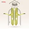 A pair of golden door handles with keyholes, presented against a stylized background with architectural elements and text. Produktbild-Vorschau
