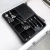 A black cutlery organizer with silver cutlery inside a white drawer. Náhled obrázku produktu