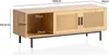 A wooden TV stand with cane-like doors and open shelving, with dimensions indicated by text overlays. Produktbild-Vorschau