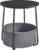 A round side table with a black wooden top and a gray fabric basket underneath, shown against a white background. Náhled obrázku produktu