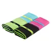 Four folded microfiber towels in different colors, arranged diagonally. Produktbild-Vorschau