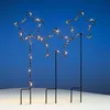 Three illuminated star-shaped garden stakes are displayed against a blue sky and a white snowy ground. Náhľad obrázku produktu