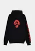 A black hoodie with a red logo on the back and red text on the sleeve. Podgląd zdjęcia produktu