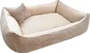 A beige corduroy dog bed with a small pillow inside, isolated on a white background. Náhled obrázku produktu