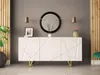 A white sideboard with a geometric pattern and gold legs is displayed in a room with gray walls and wooden accents. Produktbild-Vorschau