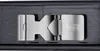 A close-up, top-down view of a metal buckle mechanism, likely for a belt or bag, presented in a dark, textured box. Anteprima dell’immagine prodotto