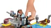 A hand is shown interacting with a LEGO Star Wars AT-TE walker. Podgląd zdjęcia produktu