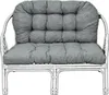 A grey cushion set on a white rattan bench. Produktbild-Vorschau