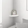 A corner shelf with decorative items on it. Produktbild-Vorschau