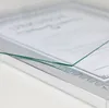 A close-up shot of a silver picture frame with a certificate inside, viewed from a slight angle. Produktbild-Vorschau