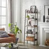 A living room scene with a ladder shelf filled with decorative items and books, next to a fireplace. Produktbild-Vorschau
